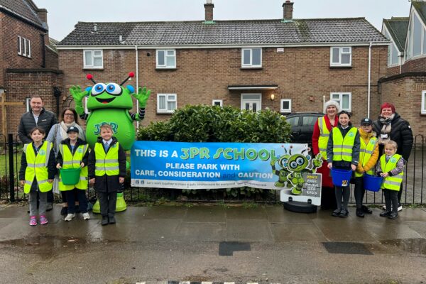 Photo of 3PR launch at St Teresa’s Catholic Primary School in Colchester on 10 January 2023: (Not in order) Councillor Martin Goss (NEPP’s Member for Colchester City Council), Ward Councillors Sue Lissimore and Leigh Tate, Mrs Kelly (Headteacher of St Teresa’s Catholic Primary School), school pupils and the 3PR costumed-character.